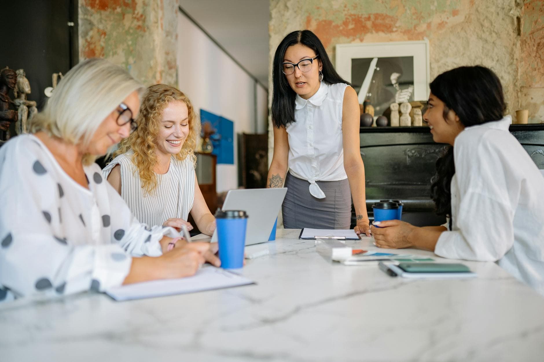 A diverse group of colleagues collaborating in a modern office meeting.